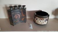 Overview photo showing both signed pottery bowl and quad vase side by side