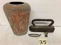 Copper vase, an old iron with handle, a small metal drawer pull, and a small brass warrior figurine on base.