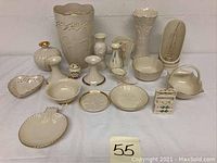 Full lot of Lenox Ware ceramics showing vases, dishes, candlesticks, miniature stove and other decorative tableware pieces.