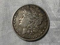 Obverse of 1900-S Morgan Dollar showing Liberty head, date and star border