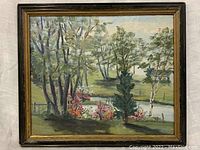 Full view of the framed oil painting showing landscape with trees, pond and flowers.