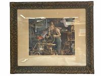 Front view of the large framed print showing the blacksmith at work and the ornate frame with visible reflections and some surface dirt.