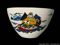 Photo showing side view of bowl with hand-painted fisherman in boat, fish, mountains in background
