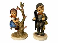 Front view of Apple Tree Girl and Chimney Sweep figurines side by side