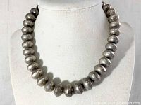 Front view of necklace on bust display showing uniform rondelle beads