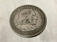 Close-up image of obverse side of 1893 Columbian Half Dollar coin showing detailed profile of Christopher Columbus and inscriptions.