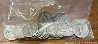 Plastic bag containing 21 unsearched silver Mercury dimes with varied dates and wear.