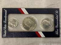 Front side of the three Bicentennial silver coins in blister card packaging showcasing the heads side with portraits and dates.