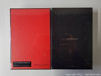 Photo of two tablets in original sealed boxes, one box red back and one box black front labeled Tronpad, indicating brand and 7 inch Android tablet PC.