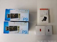 Two boxed Bluetooth speaker 3D TV enlarged screen model P9, Enacfire S20 true wireless earbuds, and iWalk power banks.