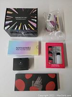 Overview of all nail art kits and boxes: Morovan, Senvenski, Tomicca, Mychao, professional acrylic system, and nail art accessories in clear bag.