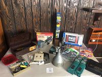 Photo showing the full lot of tools, locks, clock, sun shades, and other items arranged on a surface