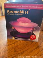 Original box of AromaMist Ultrasonic Fountain showing product image and dimensions (10" x 9")