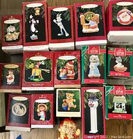 Overview photo showing majority of Hallmark Keepsake Ornaments in original boxes, including Looney Tunes and collector's series items.