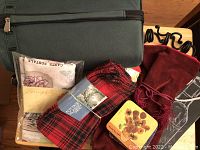 Photo showing zippered wine tote, two sets of napkins, metal napkin rings, wine gift bags, and Van Gogh coaster set.