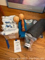 Full lot showing scale, foam roller, wooden rollers, towels, and leash attachments grouped together on the floor.