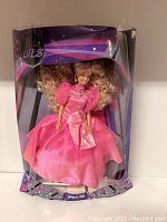 Front view of Barbie Nite Lites doll in original packaging showcasing the pink dress and styled hair.