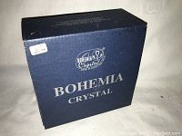 Blue cardboard box labeled 'Bohemia Crystal Made in Czech Republic' with white price sticker.