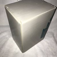 White Partylite box with slight corner wear, front side visible