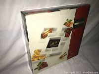Box front showing the 5-piece dish set arranged with various foods in the dishes including strawberries, lemon slices, and breadsticks.