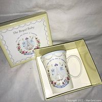 White ceramic mug with Royal Baby crest design inside cream box