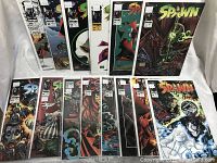 Front view of Spawn Comics Issues No. 10 to 23, each individually bagged and boarded, showing cover artwork and condition.