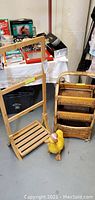 Full view of the wooden towel rack, wicker storage unit, and painted wooden duck figure showing their size and details.