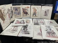 Full collection of 15 vintage Cream of Wheat advertising prints arranged on table and standing back to back, some in protective sleeves.