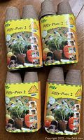 Four sets of Jiffy-Pots 2 biodegradable seed starter pots, unopened in their original packaging, each set containing 26 pots.