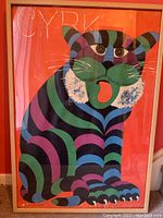 Front view of framed Cyrk poster featuring colorful cartoon tiger on orange background with 'CYRK' text.