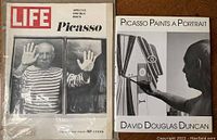 Photo showing the cover of the vintage Life magazine Picasso issue and the book "Picasso Paints a Portrait" by David Douglas Duncan side by side.