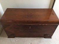 Top view of closed cedar chest showing wood grain and finish.
