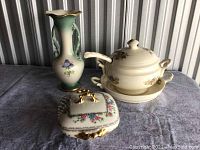 Group photo of Limoges porcelain items: vase, covered tureen with underplate, and covered box