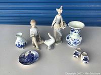 Overview of all seven ceramic and porcelain items showing figurines, vases, and decorative pieces.