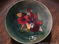 Top-down view of bowl showing entire floral pattern and teal-green interior.