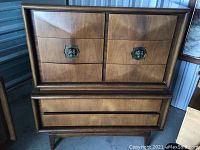 Front view of full armoire showing two doors and lower drawer.