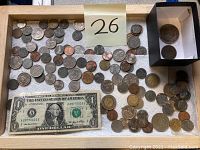 Tray of assorted US and foreign coins, loose and in a small box, with a US one dollar bill