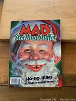 Front cover of the MAD Stocking Stuffer collector edition magazine showing a colorful illustration of Santa Claus with 'HO-HO-HUM! 96 pages of holiday mirth!' text.