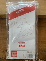 Front of package showing DAS Dance branding, dancer outline illustration, size chart, and 80D denier marking
