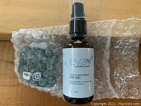 Front view of Eva Naturals Youth Restoring Eye Gel bottle packaged with bubble wrap, showing label and pump dispenser.