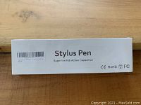 Box packaging of the stylus pen showing product name and certification marks.