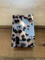 Front view of box showing PlayBoy Wild branding, leopard print design, and product details (90ml 3.0 FL OZ eau de toilette spray)