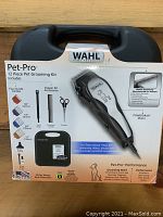 Full kit box photo showing Wahl Pet-Pro 12 Piece Pet Grooming Kit in case with trimmer image and key contents.