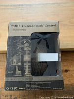 Box of CSB10 Outdoor Bark Control device showing front and part of the device through transparent window.