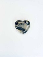Front view of the polished hand carved ocean jasper heart-shaped gem showing natural color patterns and polish.