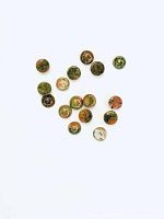Sixteen round natural unakite cabochon stones arranged together on a white background displaying their color and pattern variety.