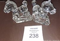 Pair of clear heavy glass horse figurines with auction lot number visible