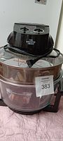 Sharper Image New Wave Cooker with power cord visible, control knobs and clear glass bowl