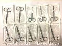 Top view of multiple MED-RX Littauer hospital surgery grade sterile scissors individually packaged in clear plastic sterile envelopes, showing the scissors inside.