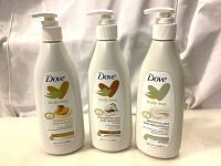 Three new Dove Body Love lotion bottles, 13.5 fl oz each, in Glowing Care Mango Almond Butters, Pampering Care Shea Butter, and Restoring Care Ceramide variants.